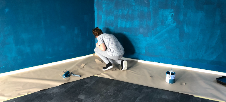 man painting his living room
