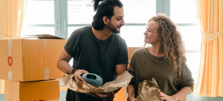 a man and a woman trying to apply packing tips for for flying