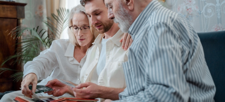 The family is looking at pictures