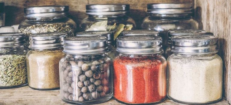 a shelf with jars of different foods