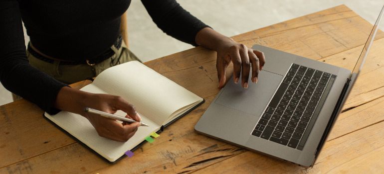 Woman researching traits of reliable commercial movers.