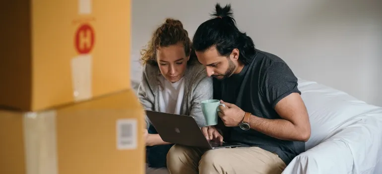 focused couple renting a self storage unit online
