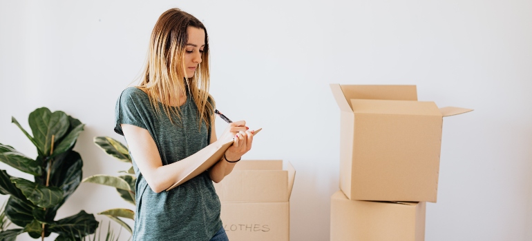 focused woman checking her boxes