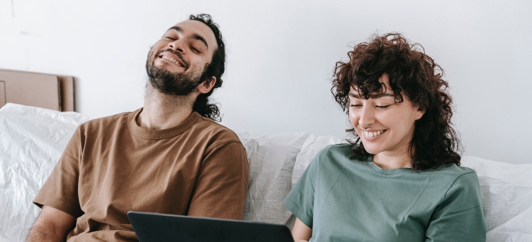 happy couple hiring professional movers