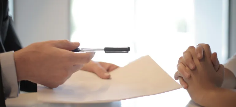 a person renting a self storage unit and signing a contract