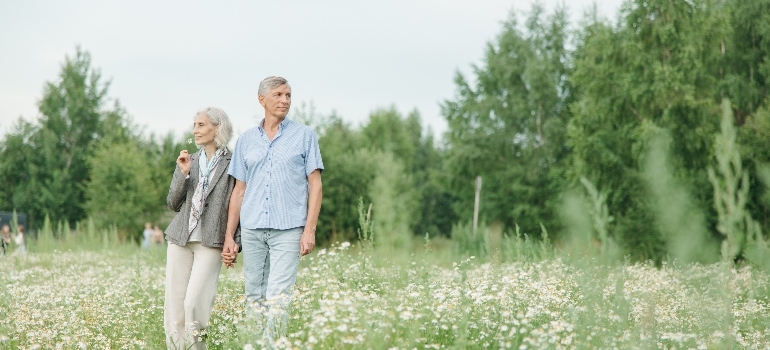 an elderly couple in the field