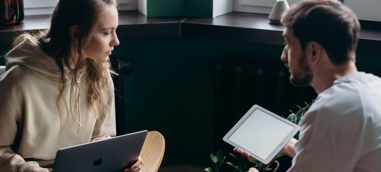 man and woman looking for movers online