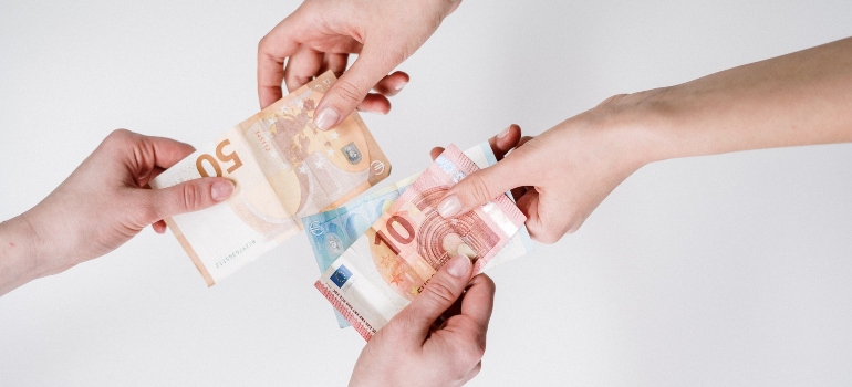 man and woman exchanging money
