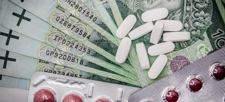 blisters of pills on money