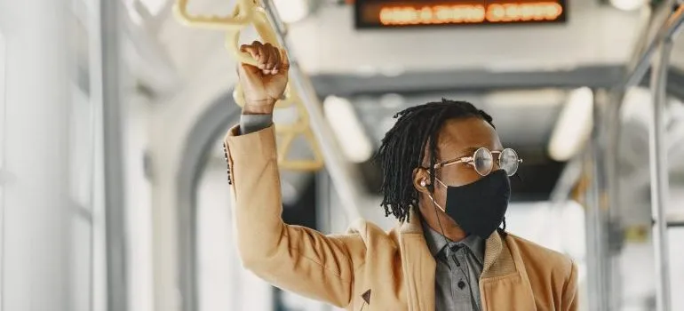 Person on public transportation with a face mask