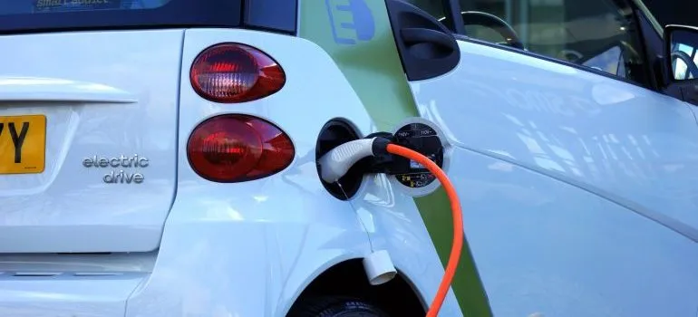 White electric car that you can use to reduce your carbon footprint during Seattle relocation