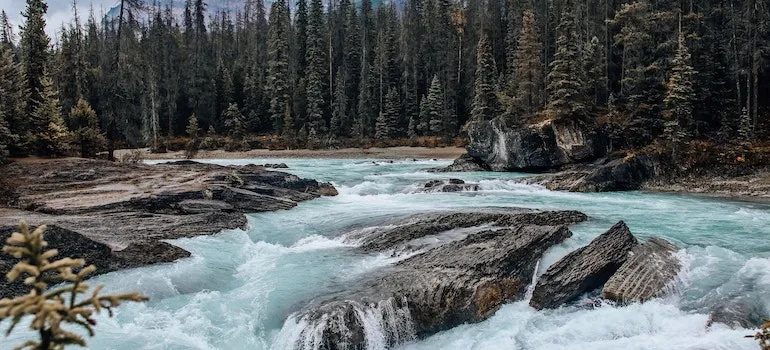 Beautiful Landscape of a Creek and Mountains in Distance