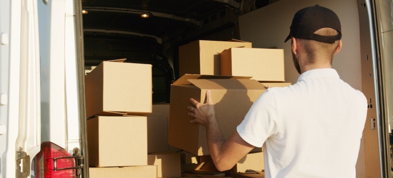 A Man Stacking Boxes in a Van of one of the best moving companies Marysville WA has