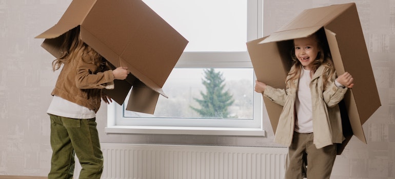 Kids Playing with Cardboard Boxes while staying safe during your Lynnwood move