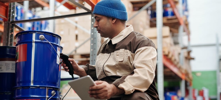 A man scanning a bucket during inbound and outbound handling