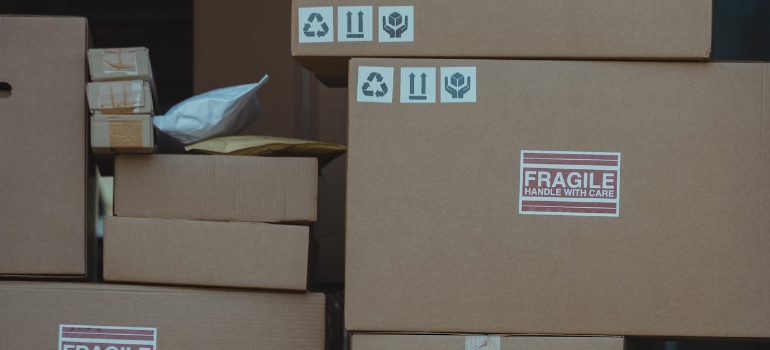 Close-up photo of stacked carton boxes symbolizing growth of e-commerce and its impact on shipping