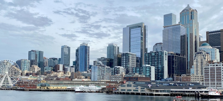 Seattle skyline across body of water during daytime at the Port of Seattle