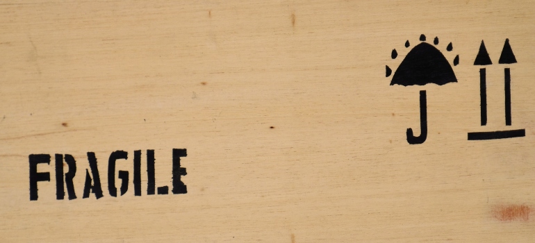 A crate labeled Fragile used for shipping large or valuable items