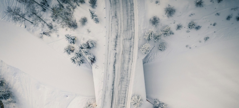 A road passing through a snowy landscape 