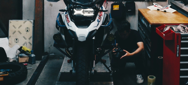 a person working on a motorcycle