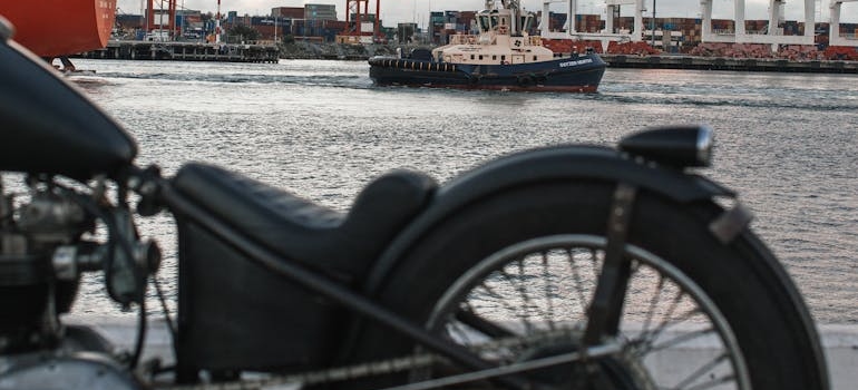 A Motorbike parked next to seaport