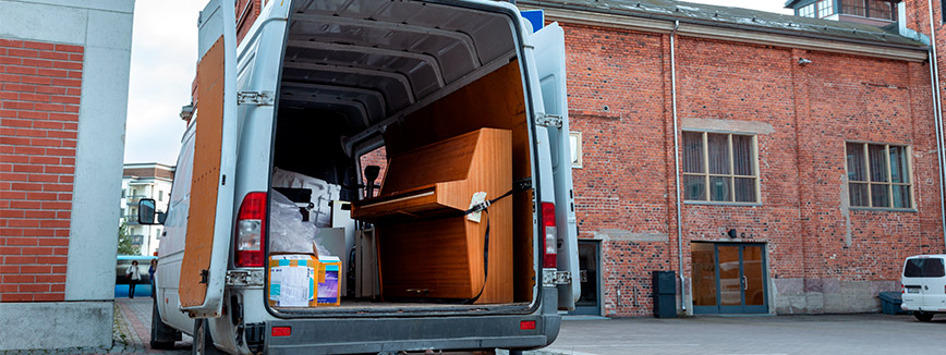 A moving truck with a large box in the back, symbolizing professional piano movers in Seattle.